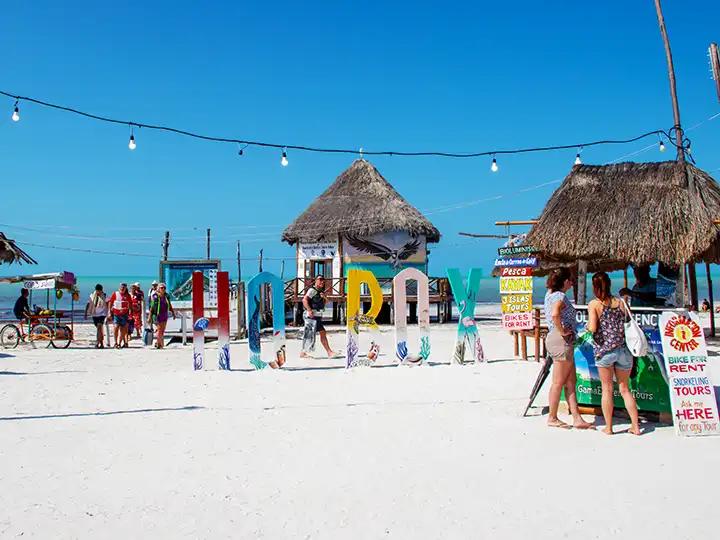 Tourists on the beach for Isla Holbox activities