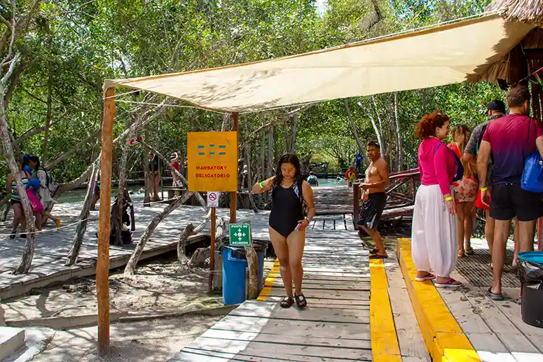 Handing out life jackets for swimming in the cenote