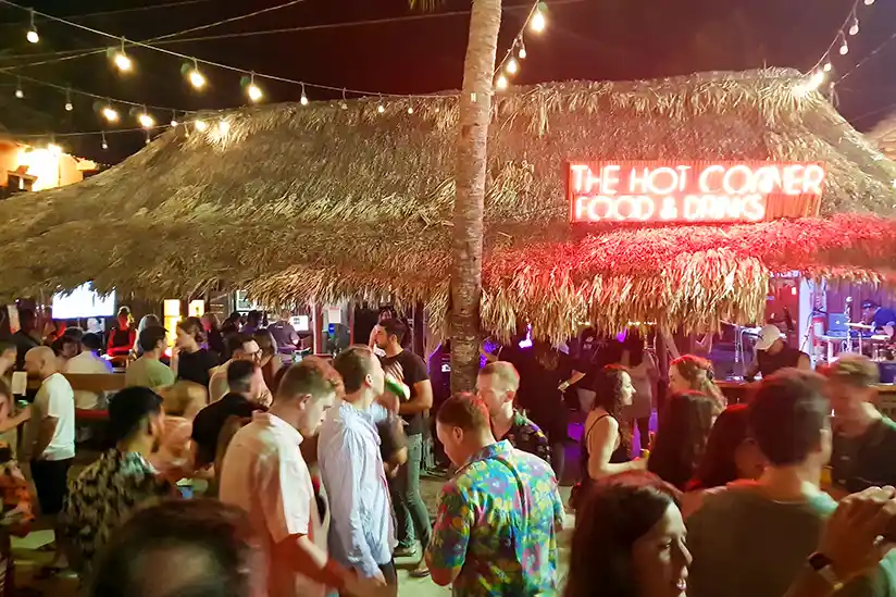 People gather at the Hot Corner Bar in Holbox to experience the nightlife.