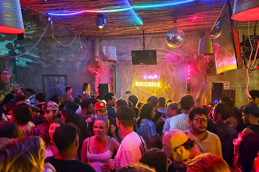 People dancing at the atmospherically lit Chinicuil club in Holbox to the music of DJ Wilde.
